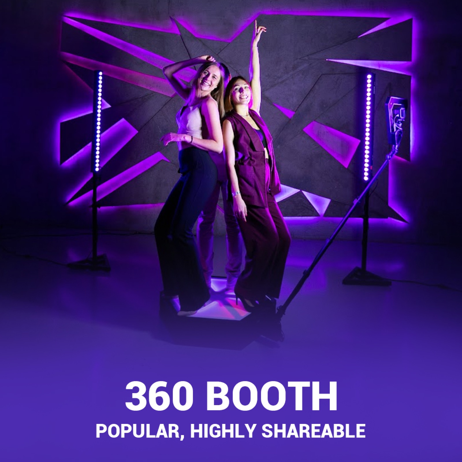Two guests posing on DMA's 360 video booth platform