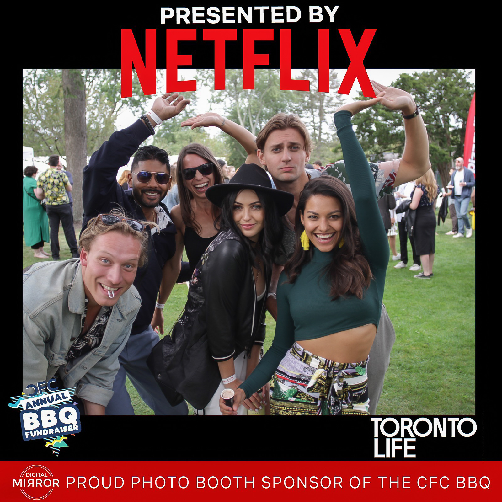 Guests posing together at a DMA photo booth activation
