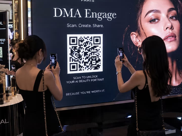 Guests at an experiential brand display scanning a DMA Engage QR code